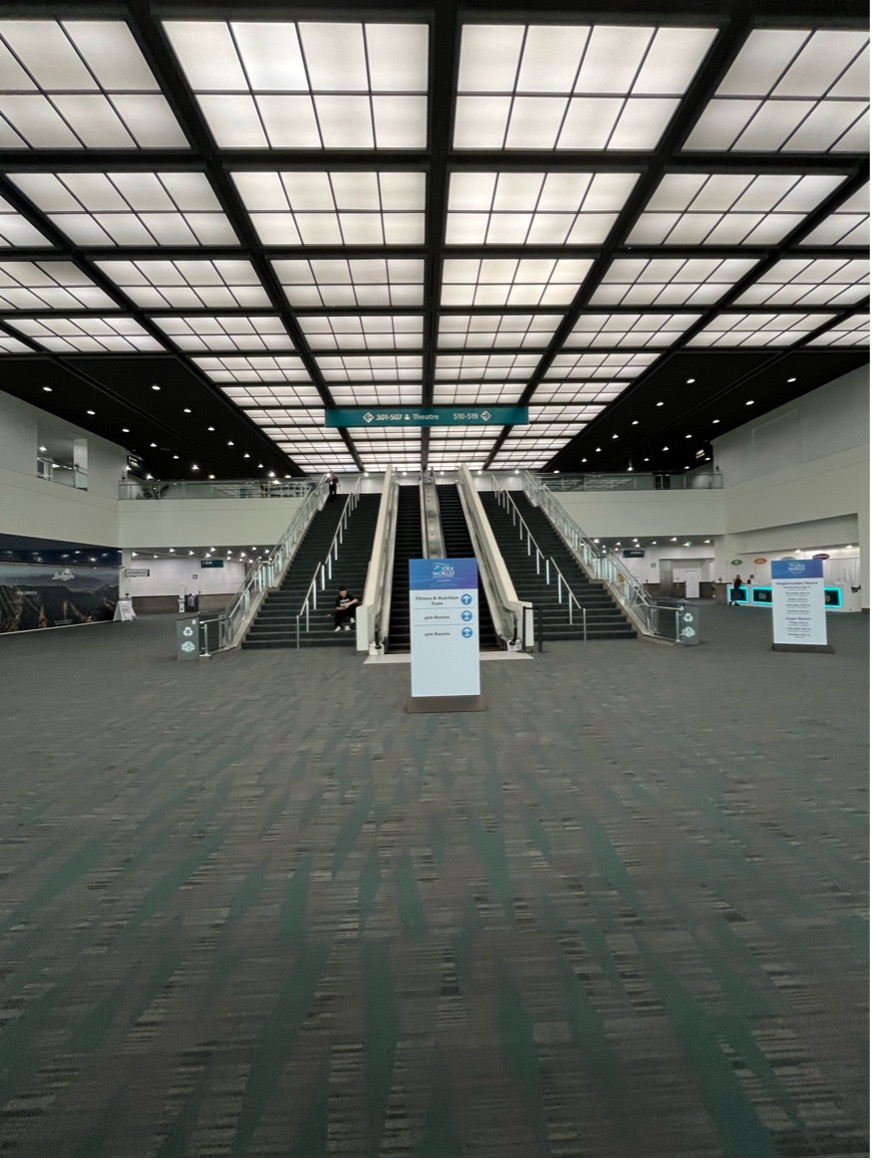 The West Hall Lobby is a spacious room with two sets of escalators in the middle. Registration, the Help Desk, and Accessibility Services will be along the righthand wall. 